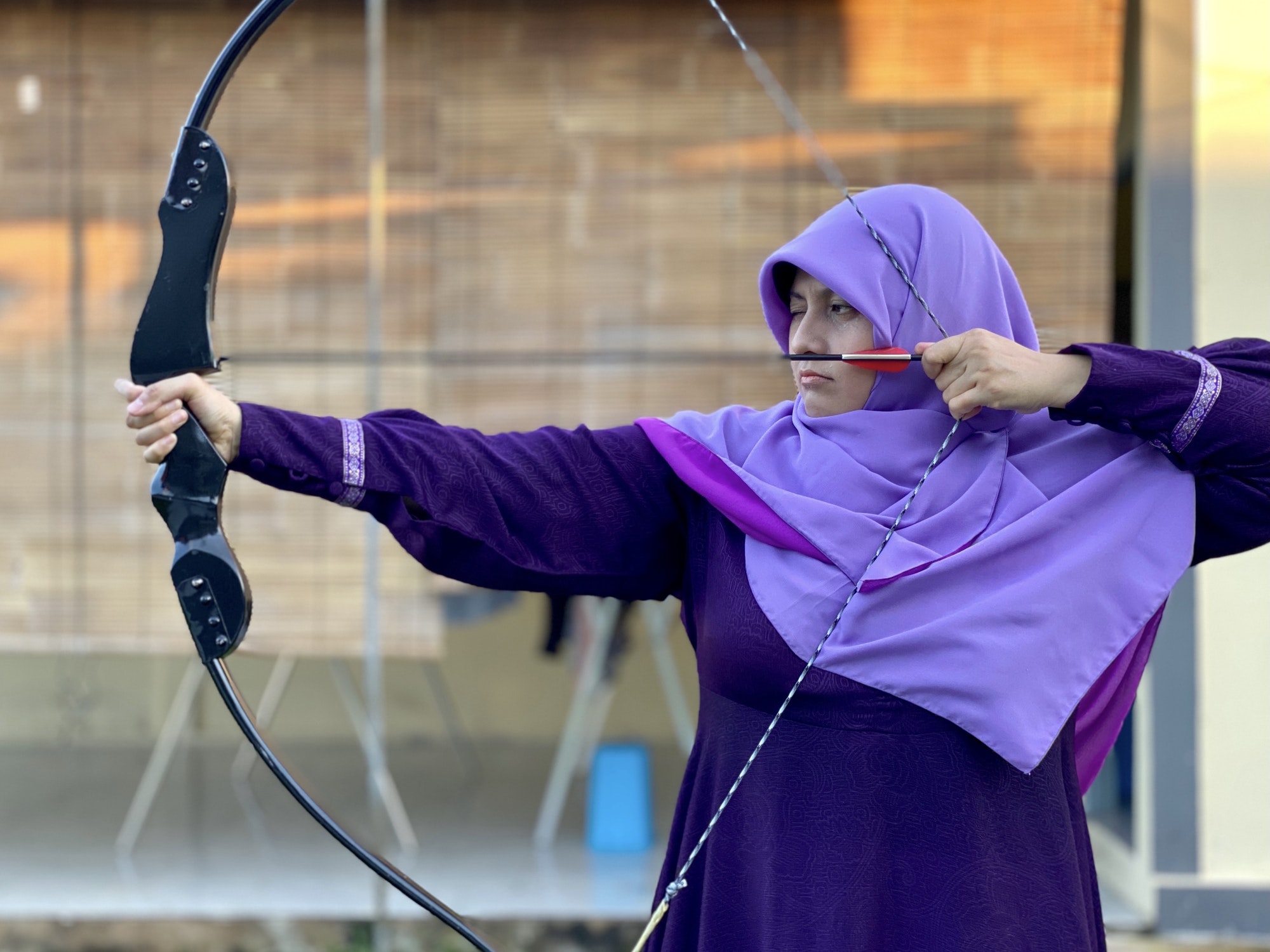 Young woman doing archery